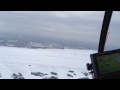 Helicopter flying over Cleeve Hill covered in snow